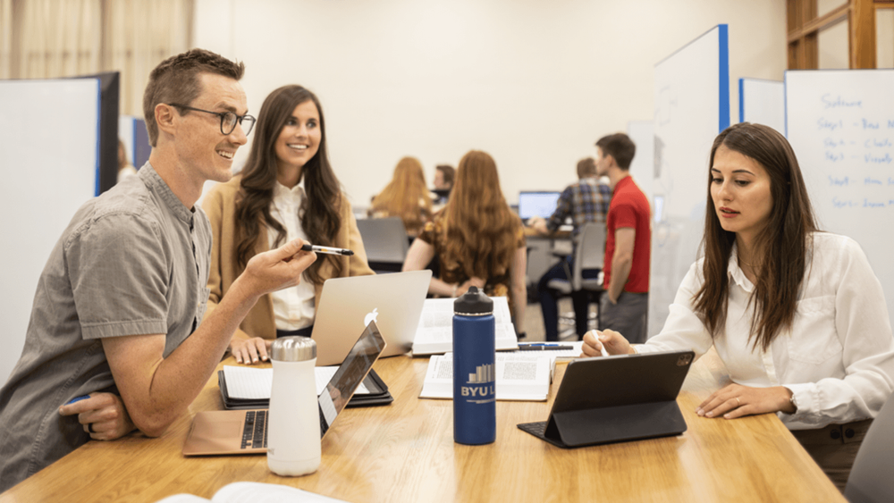 Law students discussing together at a table