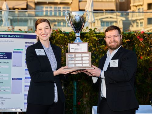 BYU Law students Erica Lovell and Jason Collyer hoist the ABA MAC Cup